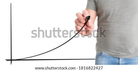 man in casual clothing drawing exponential curve, business success concept Royalty-Free Stock Photo #1816822427