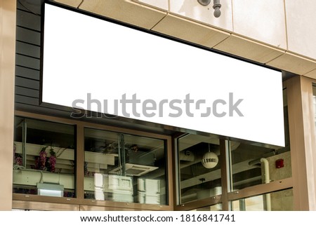 horizontal black empty signage on clothes shop front with glass windows