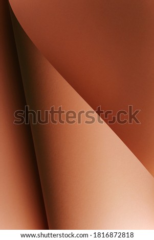 A vertical skin toned flat lay background with sharp layers and shadows with copy space