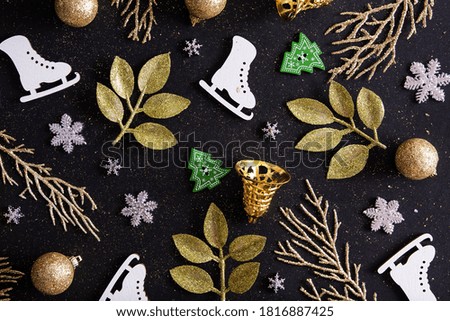 Top view Merry Christmas black background decorated with Christmas trees, snowflakes, skates, bells. Winter holiday pattern