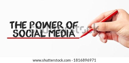 Hand writing THE POWER OF SOCIAL MEDIA with red marker. Isolated on white background. Business, technology, internet concept. Stock Image