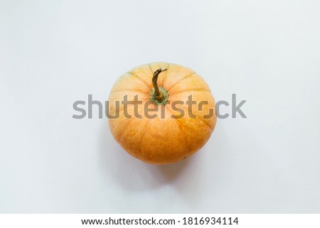 Pumpkin on white background. Halloween concept. Flat lay, top view