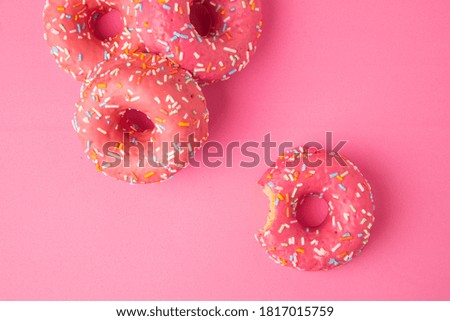 pink donut on pink background