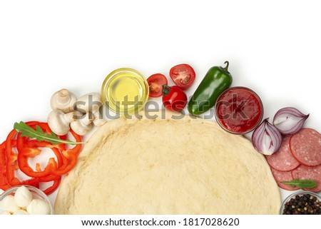 Dough and ingredients for cooking pizza isolated on white background