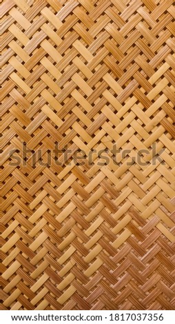 a woven bamboo background on the wall of the house. traditional and natural style.