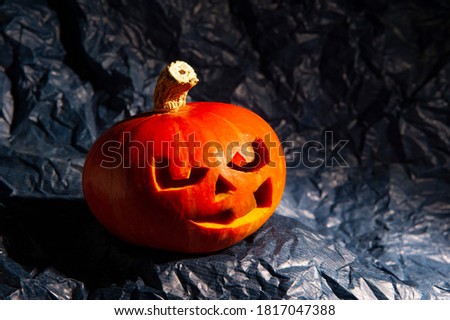 Halloween Pumpkin on crumpled paper background