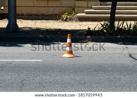 Traffic cone on the carriageway.