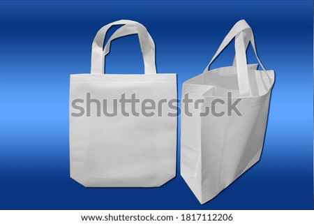 beautiful shopping bags on blue background