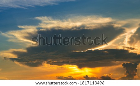 Golden sunset sky. Heaven sky. Blue and yellow sky with white cloud. Golden sun light at dusk. Beauty in nature. Beautiful natural pattern of golden sunset sky. Dusk and dawn times abstract background