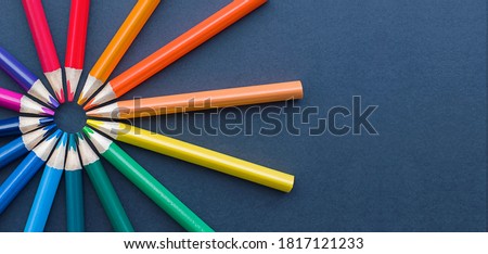 colored pencils are laid out in a circle. business concept