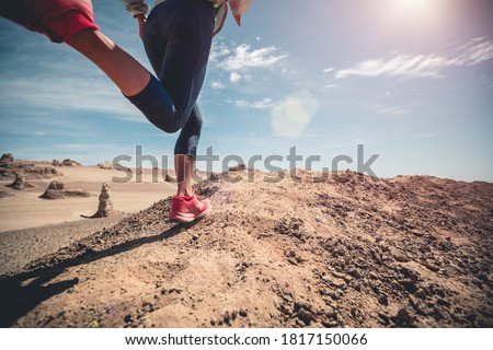 Fitness woman trail runner cross country running  on sand desert Royalty-Free Stock Photo #1817150066