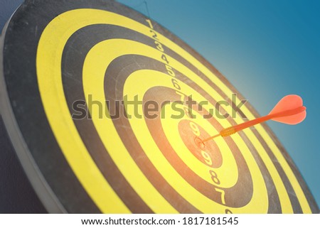 Business goal concept Close-up of arrows hitting the board, yellow and black pattern. Symbol showing business achieve corporate goals.