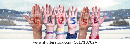 Children Hands Building Word Gruesse Means Greetings, Snowy Winter Background