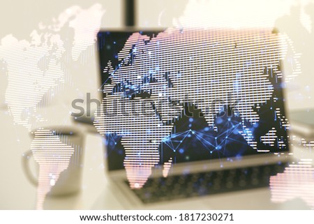 Double exposure of abstract digital world map on laptop background, research and strategy concept