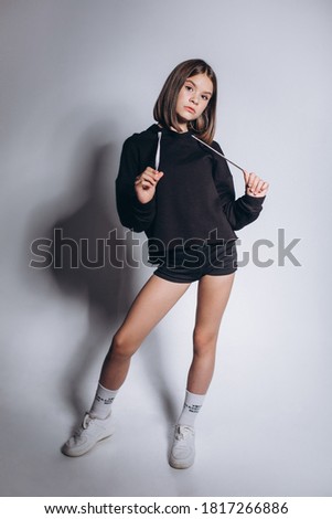 Close up sporty gymnast girl portrait isolated on grey background, young beauty brunette asian girl