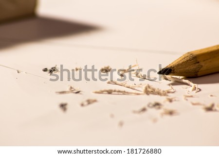 A pencil on a sheet that was scrubbed by a rubber