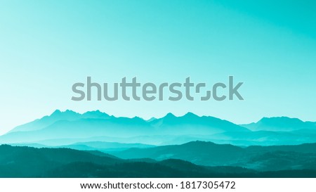 Green surreal mountains against the backdrop of a turquoise sky, fantastic fairytale mountain landscape Royalty-Free Stock Photo #1817305472
