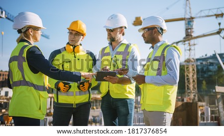 Diverse Team of Specialists Use Tablet Computer on Construction Site. Real Estate Building Project with Civil Engineer, Architect, Business Investor and General Worker Discussing Plan Details.