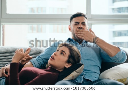 Man Yawning During Boring Conversation With Partner Royalty-Free Stock Photo #1817385506
