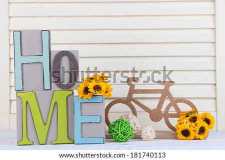 Composition with decorative letters on table on wooden background