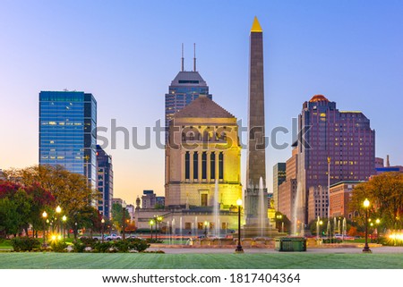Indianapolis, Indiana, USA war memorials and skyline at twilight.