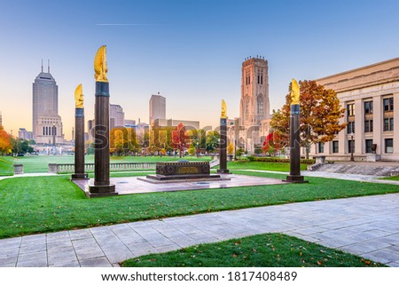Indianapolis, Indiana, USA monuments and downtown skyline at dusk.