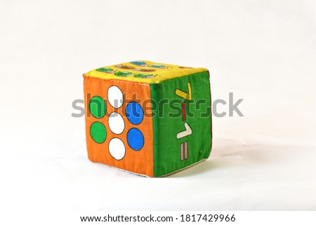 Children's soft colored cube on a white background