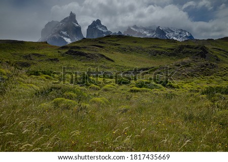 A moody image of Torres del Paine, Patagonia, Chile as a storm approaches.