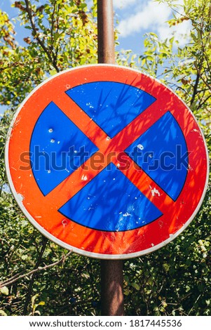 Red-blue road sign no stop - with traces of bullets