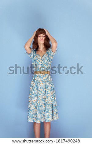 Beautiful woman With closed eyes, holding his head short hair 