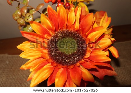 Close up on a fake orange decorative flower