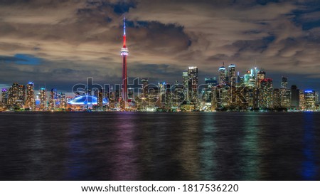 Night view of Toronto skyline and Lake Ontario, Toronto, Ontario, Canada.