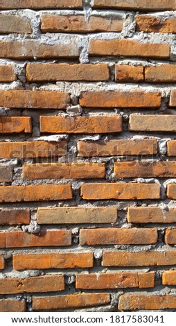 Brick walll building orange color cement  Royalty-Free Stock Photo #1817583041