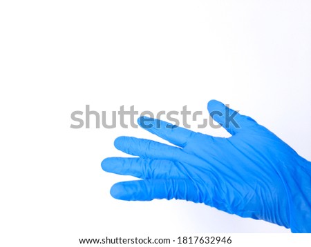 A hand wearing blue glove, asking gesture. Isolated in white background. Space for text