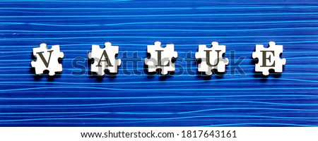 Puzzle piece with VALUE text on blue background.