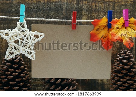 empty space copy paper hang with wooden clip and rope on wooden boards background