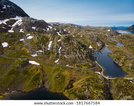Aerial view. Norway landscape. Road and lakes in stony rocks mountains. Norwegian national tourist scenic route Ryfylke. Royalty-Free Stock Photo #1817667584
