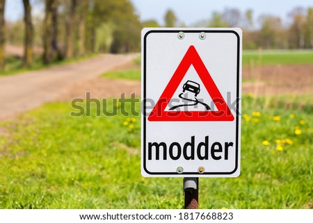 Traffic sign with text Modder or Mud along dutch road