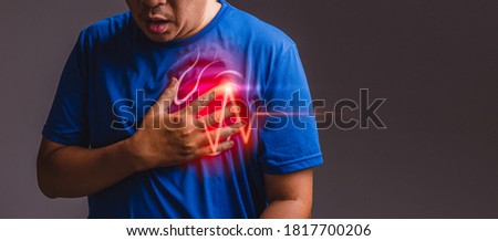 Suffering from chest pain, having heart attack after workout. Royalty-Free Stock Photo #1817700206