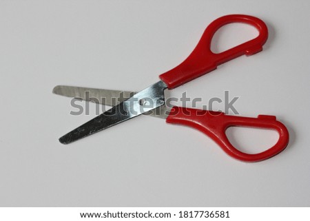 A small scissors on white background