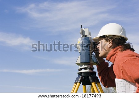 Measuring with theodolite - spring land surveying. Royalty-Free Stock Photo #18177493