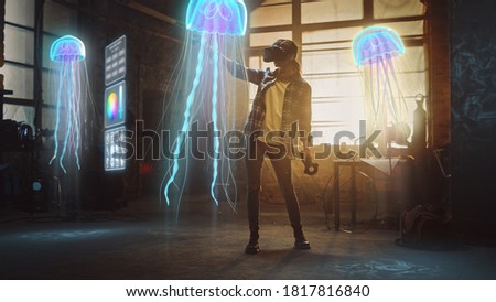 Female Artist Wearing Augmented Reality Headset Working on Abstract 3D Jellyfish Sculpture with Joysticks, Uses Gestures To Create High-Tech Internet Multimedia Concept Art.3D Animation Special Effect