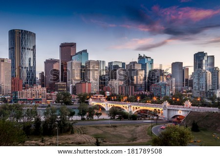 Calgary skyline at night with Bow River and Centre Street Bridge. Royalty-Free Stock Photo #181789508