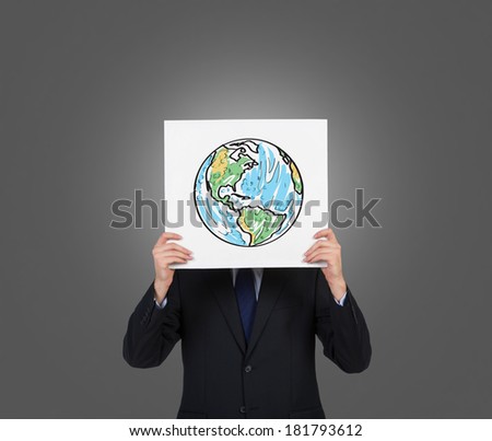 A man holding a picture with the world map (America,Canada, Brazil) Grey
