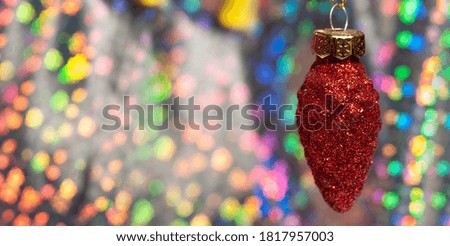 Christmas red pinecone on a shiny background