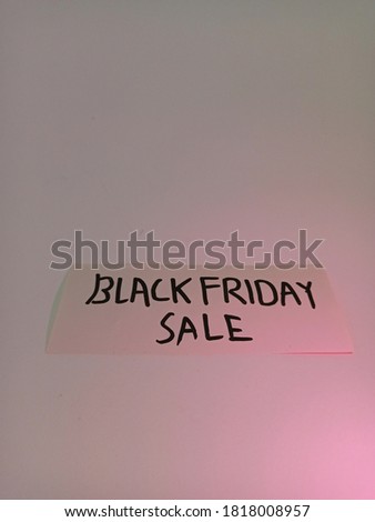Black Friday tag with gift box and color ornament on white background. Black Friday words with abstract decoration for promotion or advertisement