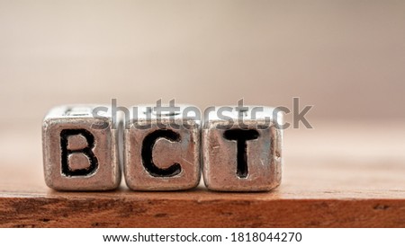 Three silver blocks placed in a row labeled "BCT". Concept Used about bitcoin currency articles.