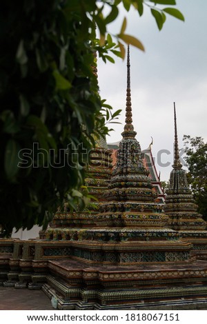 Bangkok temple colorful tiles flower pattern mosaic on Pagoda landmark architecture . Tiled Pagoda, temple of dawn, temple of Bangkok Thailand