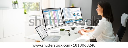Analyst Working With Spreadsheet Business Data On Computer Royalty-Free Stock Photo #1818068240
