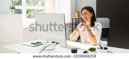Young Happy Business Woman In Video Conferencing Call Royalty-Free Stock Photo #1818068258